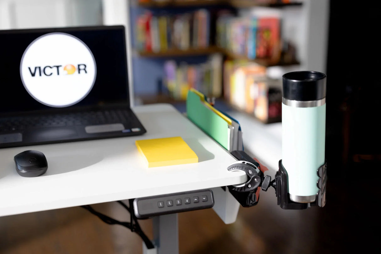 Standing desk with laptop, mouse, sticky notes, file organizer, and cup holder in home office