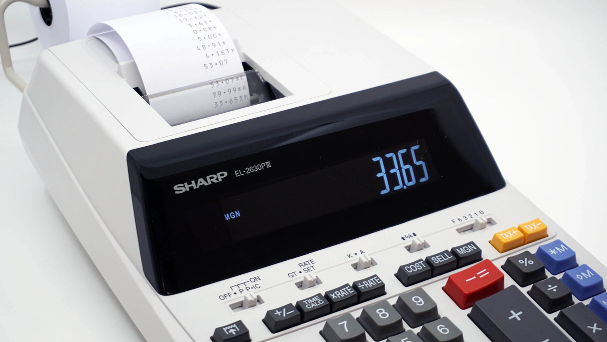 12-digit commercial printing calculator with paper roll and digital display on desk