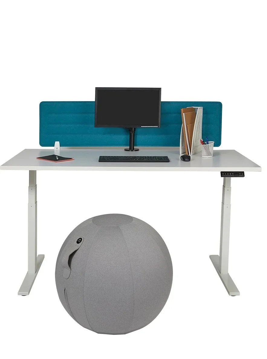 Alba MoveHop ergonomic seat ball under a white standing desk with a computer and blue divider