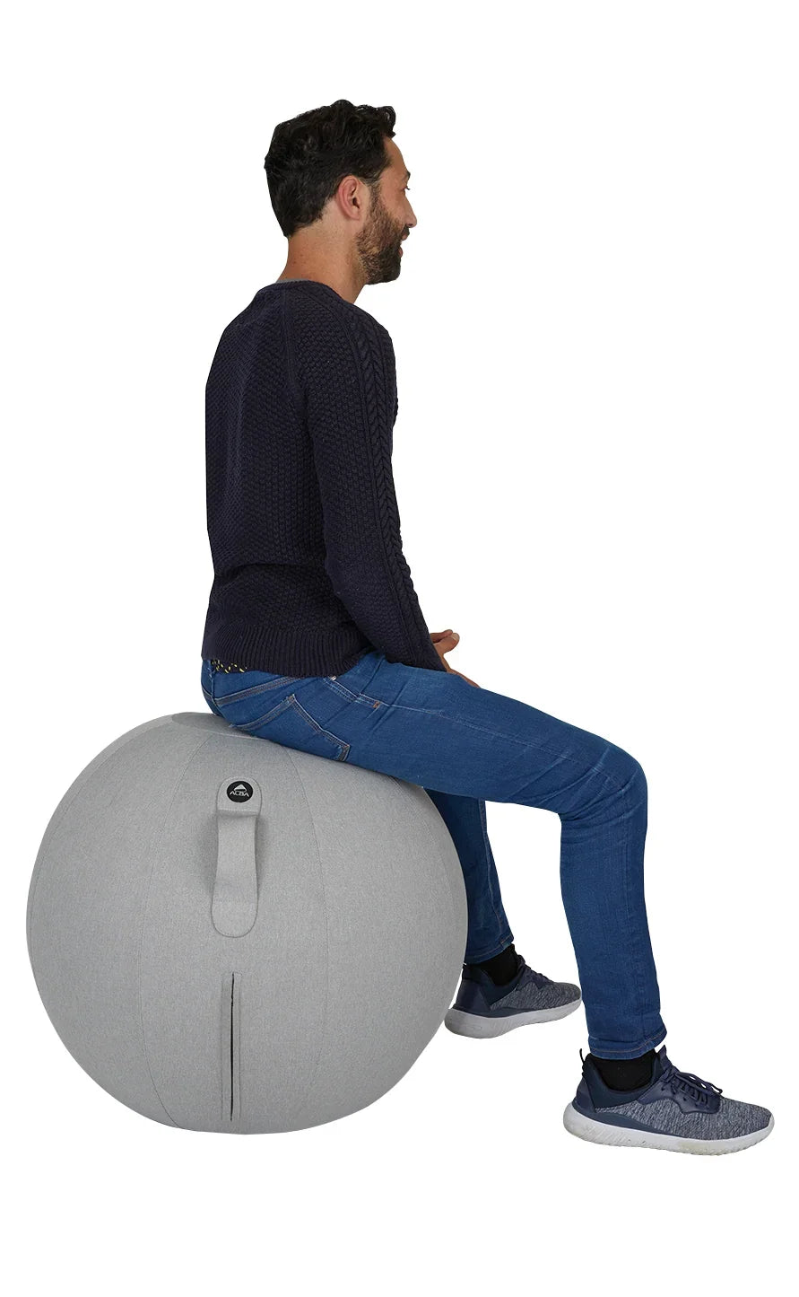 Man sitting on a grey Alba MoveHop Ergonomic Seat Ball