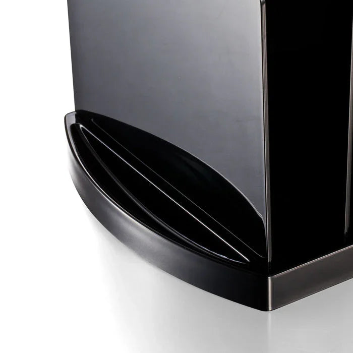 Close-up of black desktop file sorter with divided compartments for office organization