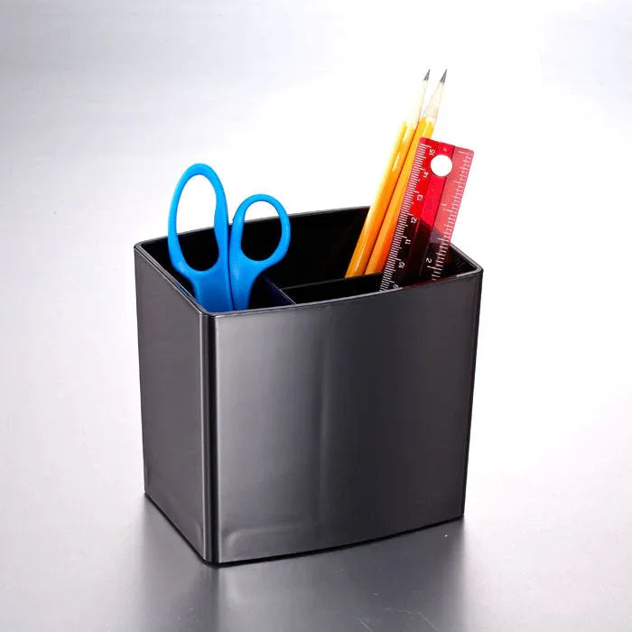 Black pencil cup organizer holding blue scissors, pencils, and a red ruler on a desk