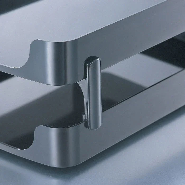 Close-up of a two-tier metal desktop organizer tray for office paperwork storage
