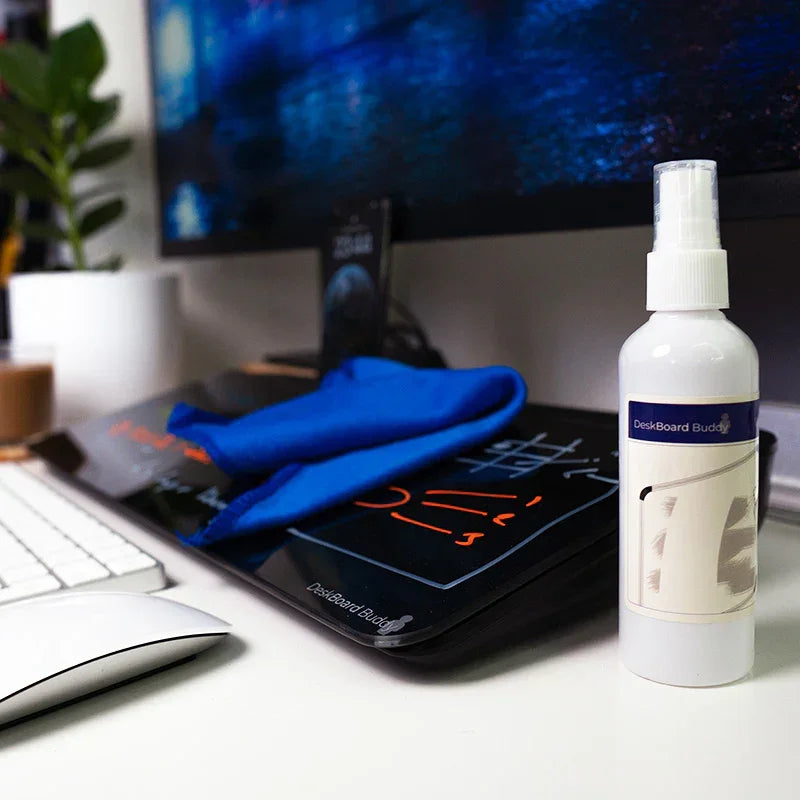 DeskBoard Buddy dry erase board, spray cleaner, and blue cloth on a modern office desk