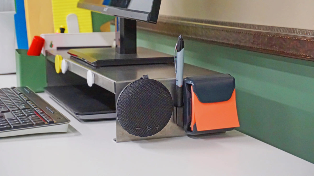 Victor® MagnetPlus magnetic wireless speaker attached to a metal desk organizer