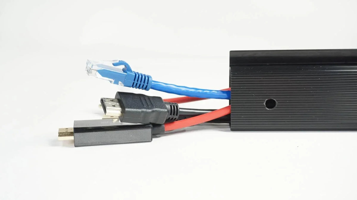 Officemate® MagnetPlus magnetic cable raceway organizing blue ethernet and black HDMI cables.