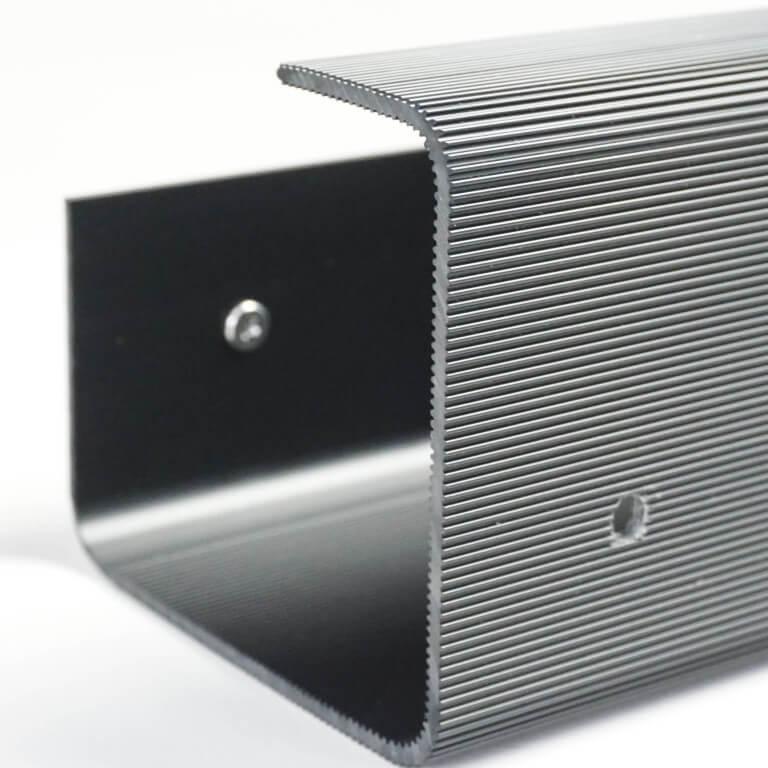 Close-up of a black ribbed Officemate Magnetic Cable Tray for workspace cable management.