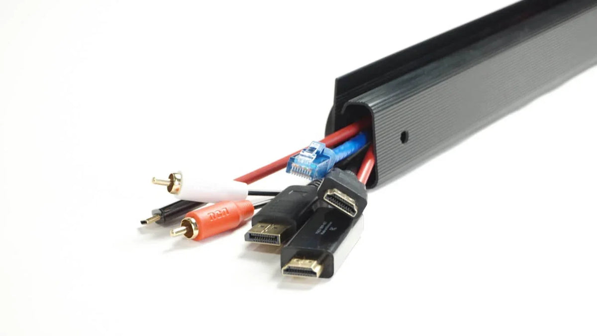Officemate Magnetic Cable Management Bundle organizing various electronic cables in a black track