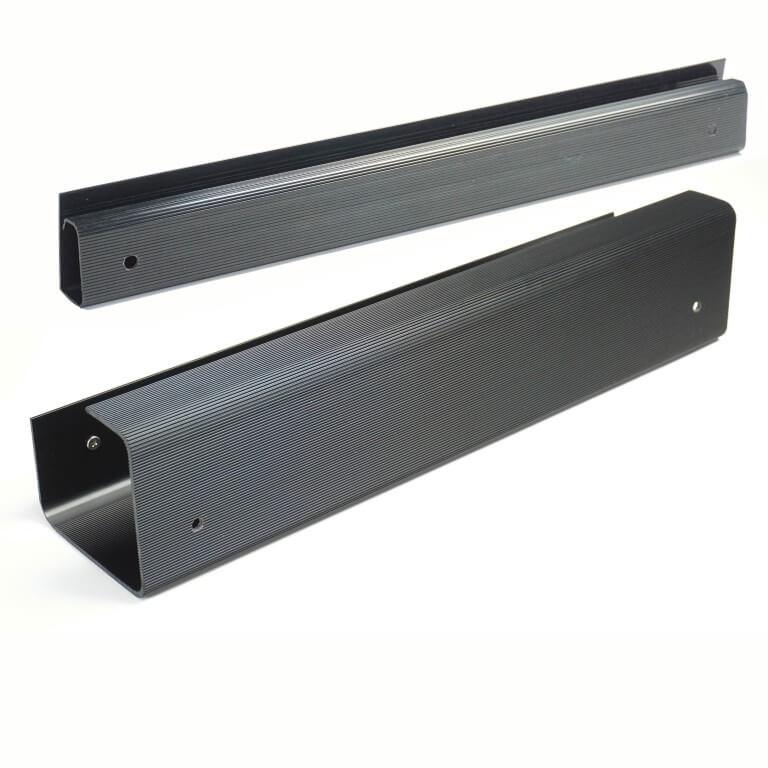 Two black Officemate magnetic cable management channels for workspace organization.