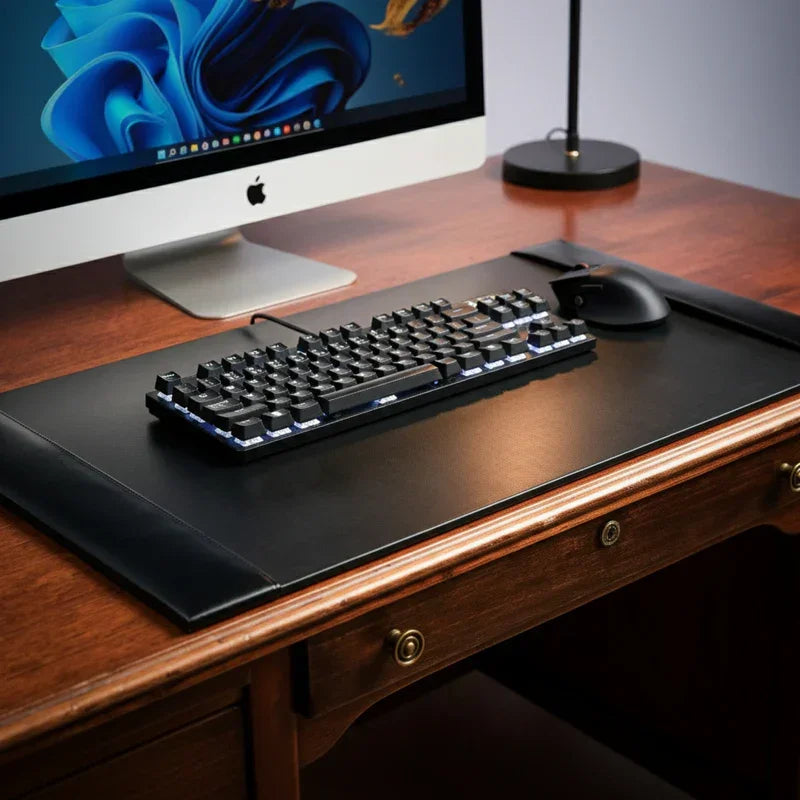 Black bonded leather desk pad 30x18 inch on wood desk with keyboard and mouse