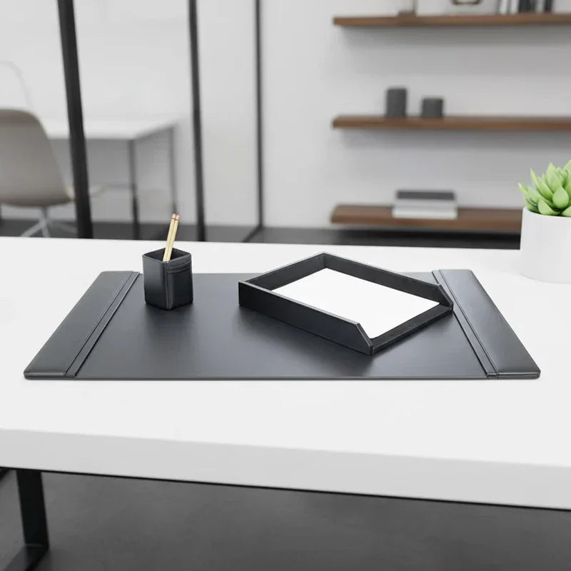 Black leather 3-piece desk set with desk pad, pencil holder, and letter tray on modern office desk