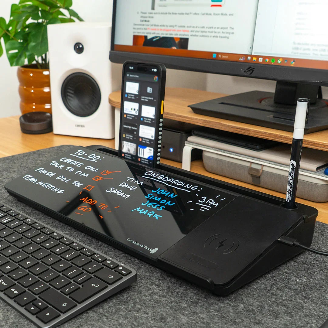Black desktop organizer with dry erase board, phone stand, wireless charger on modern workspace
