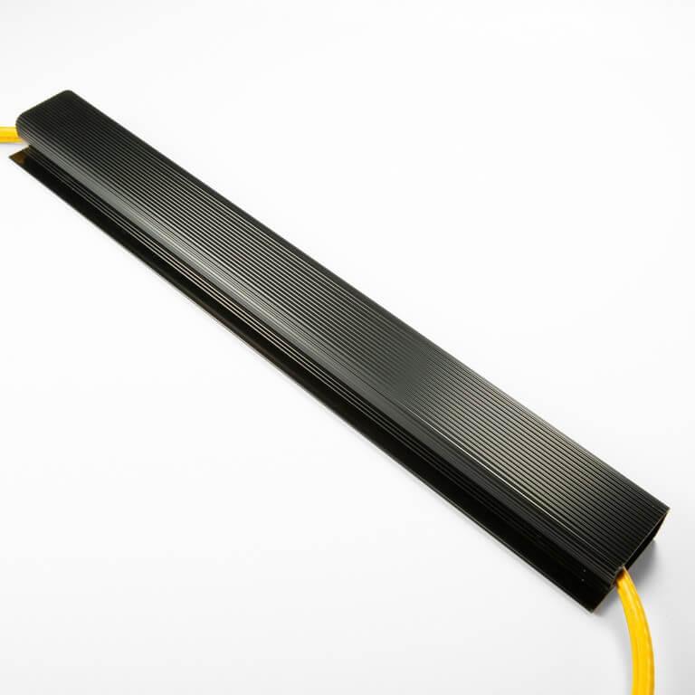 Victor black ribbed cable management sleeve with yellow cables passing through