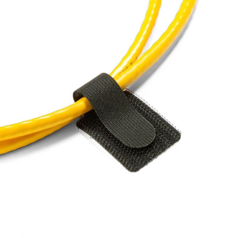 Black Victor® hook-and-loop cable tie securing yellow electrical cables