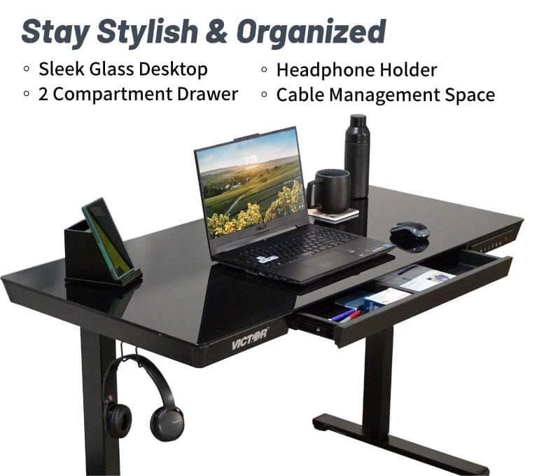 Victor® electric glass topped standing desk with drawer and headphone holder
