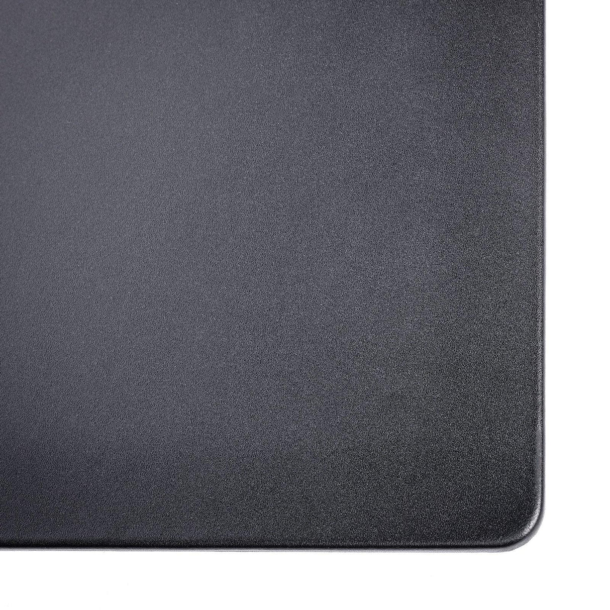 Black leather desk mat with rounded corner, textured surface, on white background