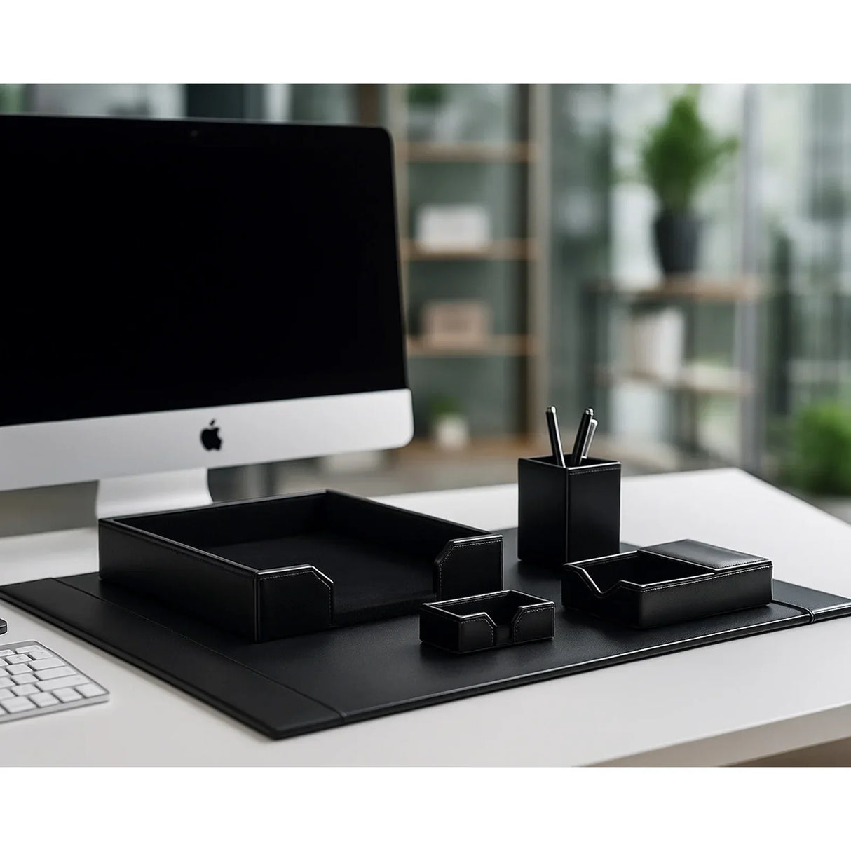 Black bonded leather 5-piece desk organizer set on modern office desktop with computer