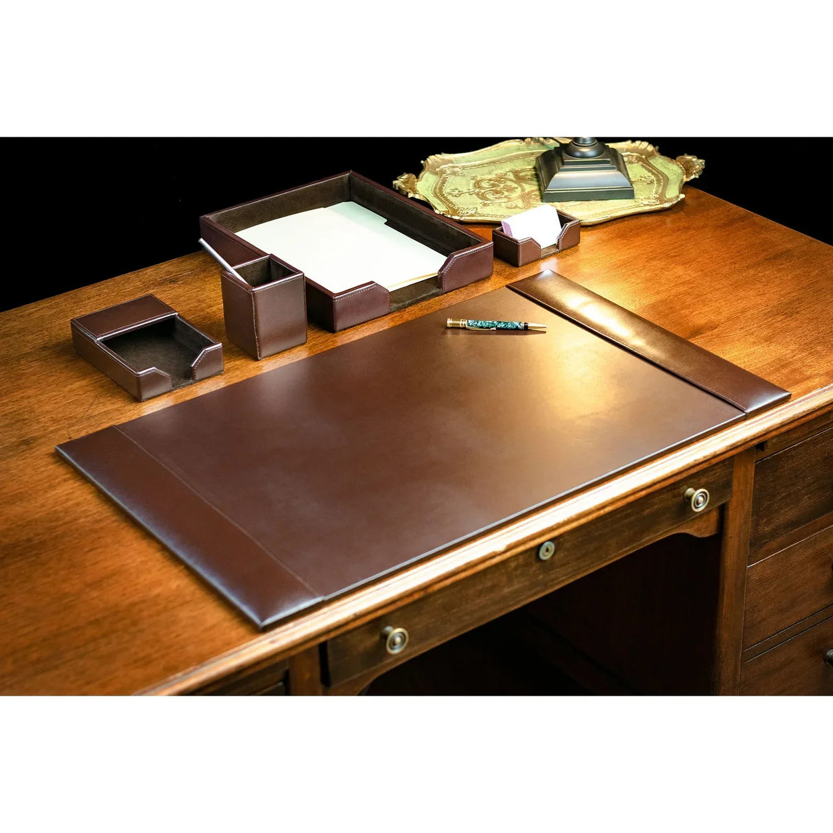 Dark brown bonded leather 5-piece desk set with desk pad, organizer trays, and pencil cup on wooden desk