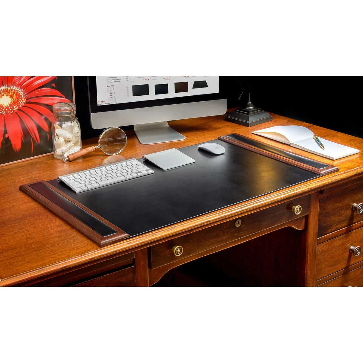 Walnut and black leather desk pad with side rails on a wooden office desk, shown with computer and accessories.
