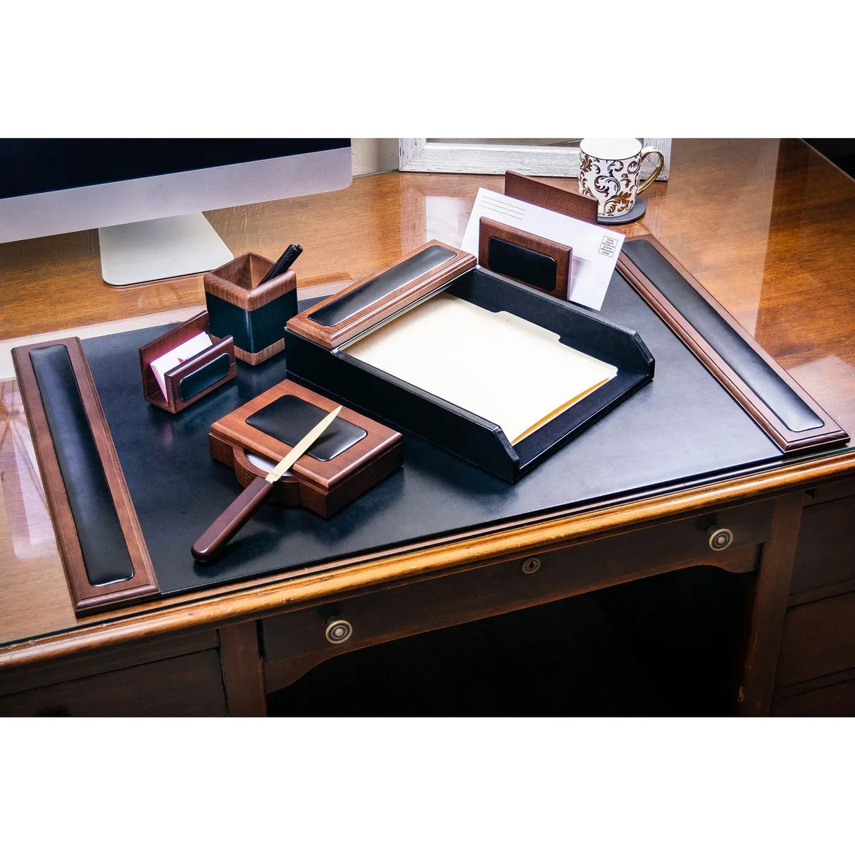 Walnut and black leather 7-piece desk organizer set on office desk with accessories