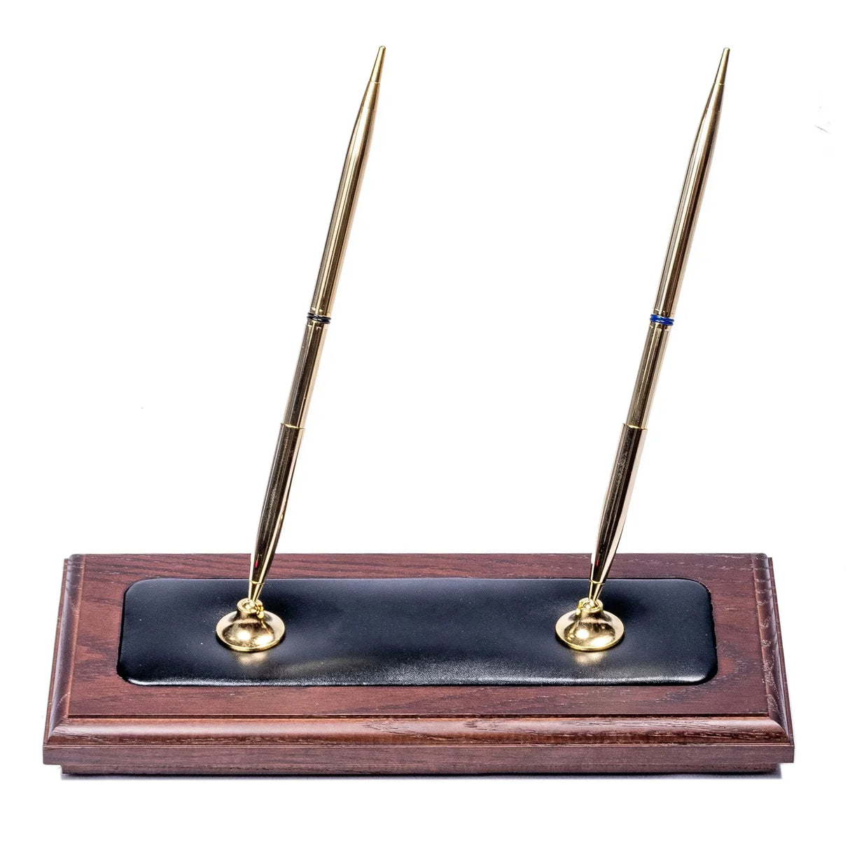 Walnut desk pen set with black leather inlay and two gold pens on a wooden base