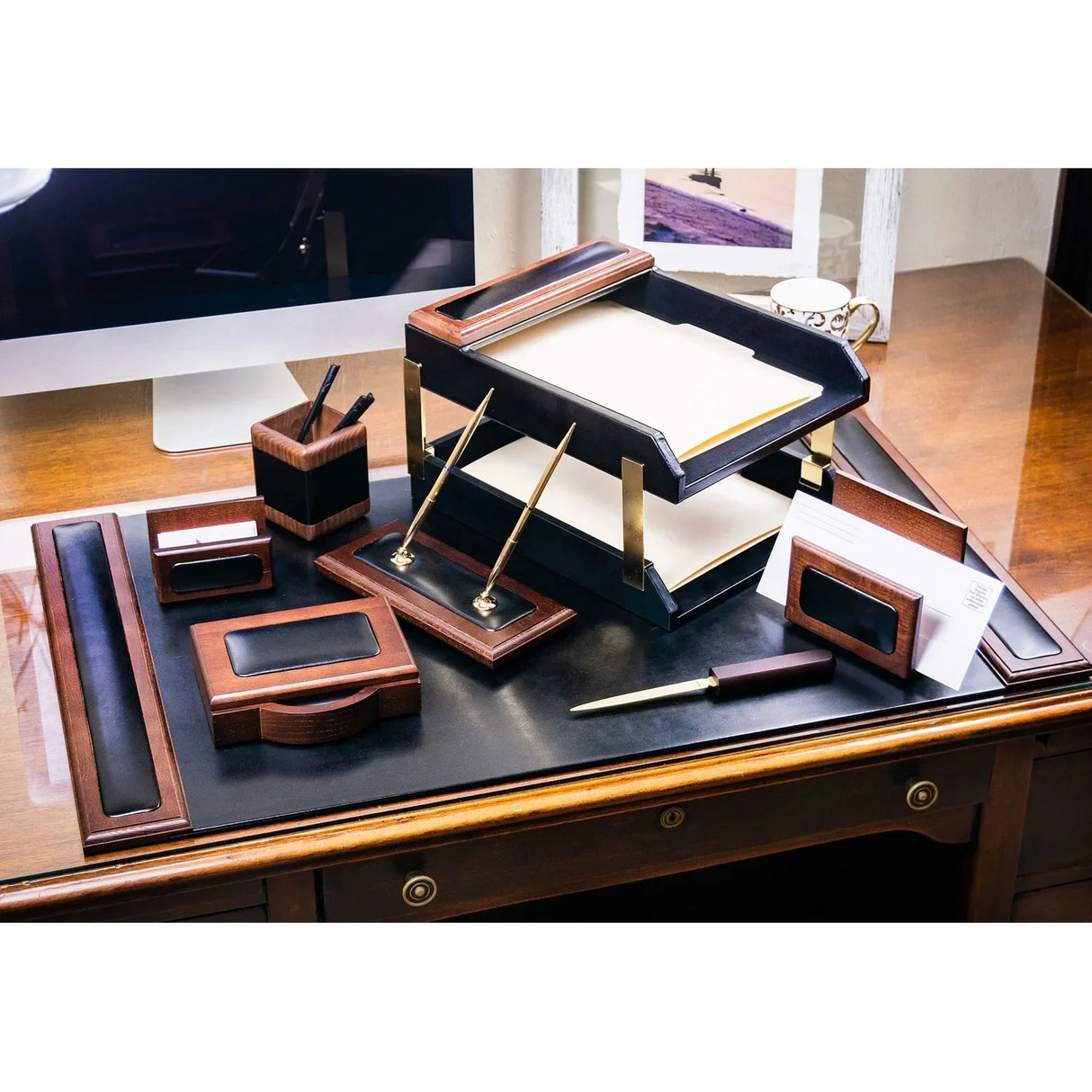 Walnut and leather 10-piece desk organizer set with trays, pen holder, and letter opener on office desk