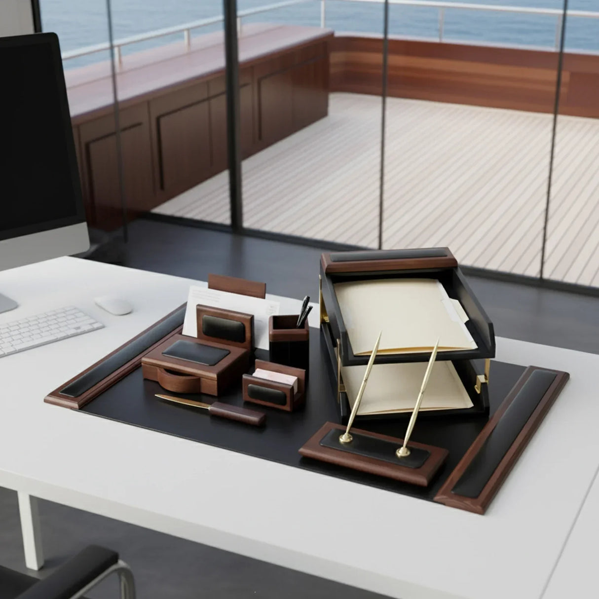 Executive walnut and leather 10-piece desk set on modern office desk with waterfront view