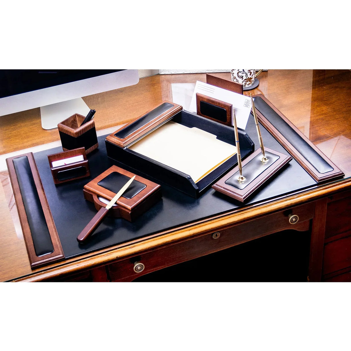 Walnut and black leather 8-piece desk organizer set on a wooden office desk