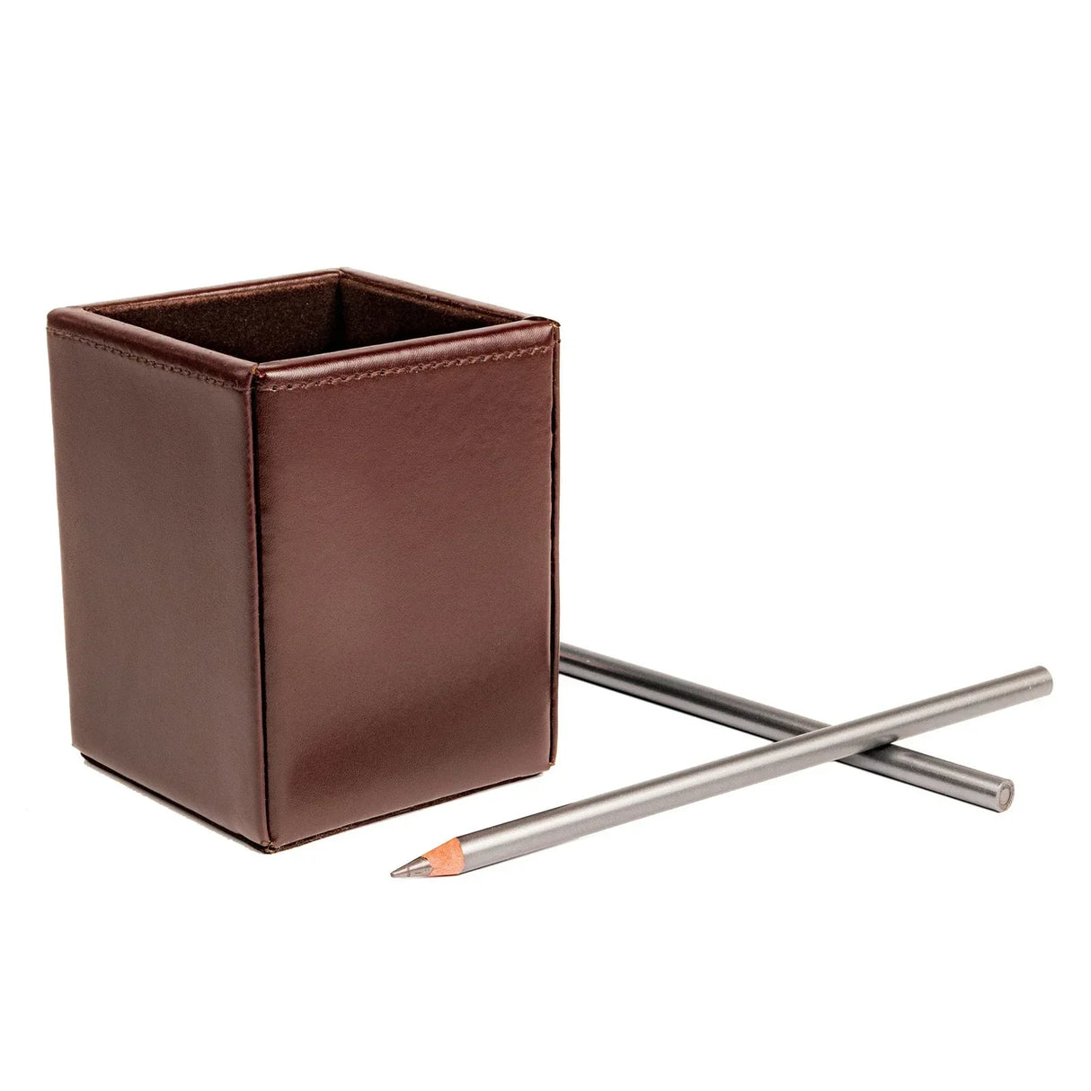 Dark brown bonded leather pencil cup with two silver pencils on white background