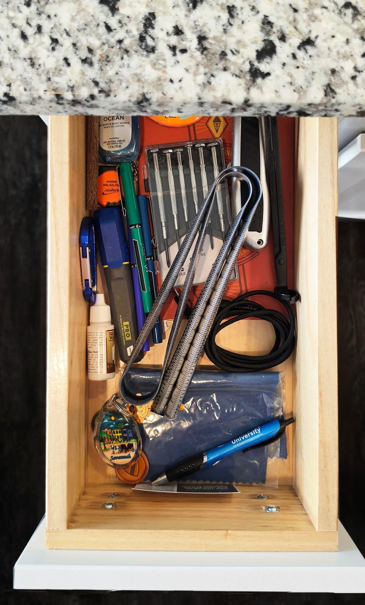 Victor® ProSpan Magnetic Measuring Tool stored in a drawer with office and craft supplies.
