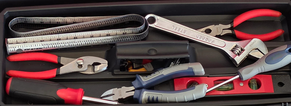Victor® Zip Stick magnetic ruler in a tool kit with pliers and a wrench