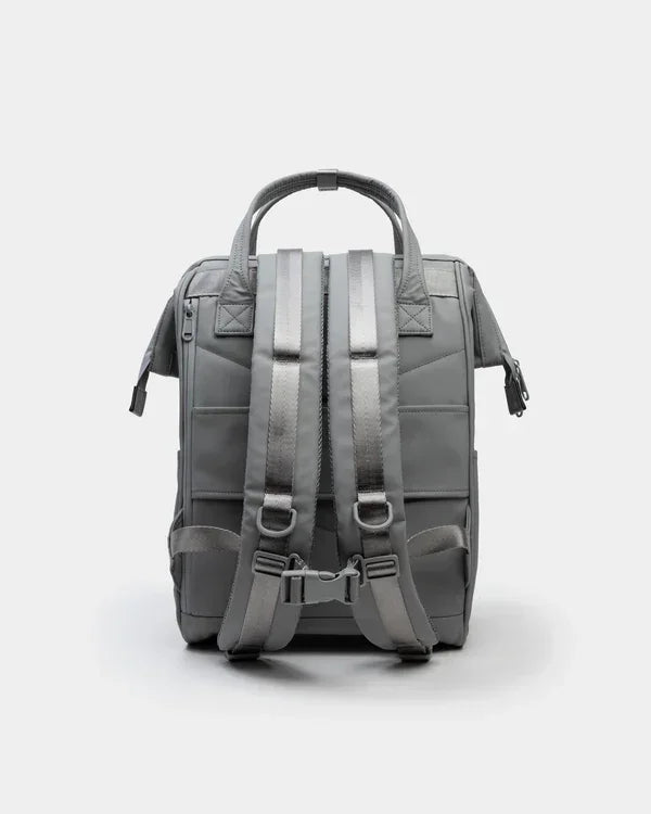 Gray backpack with padded straps and top handle, ideal for school or office use