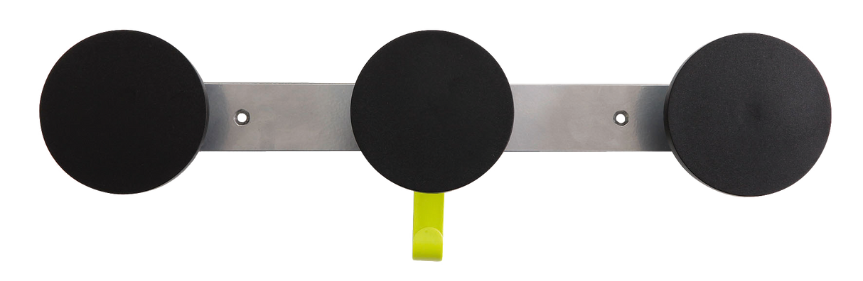 Wall-mounted organizer with three round black pads and one yellow hook for workspace storage