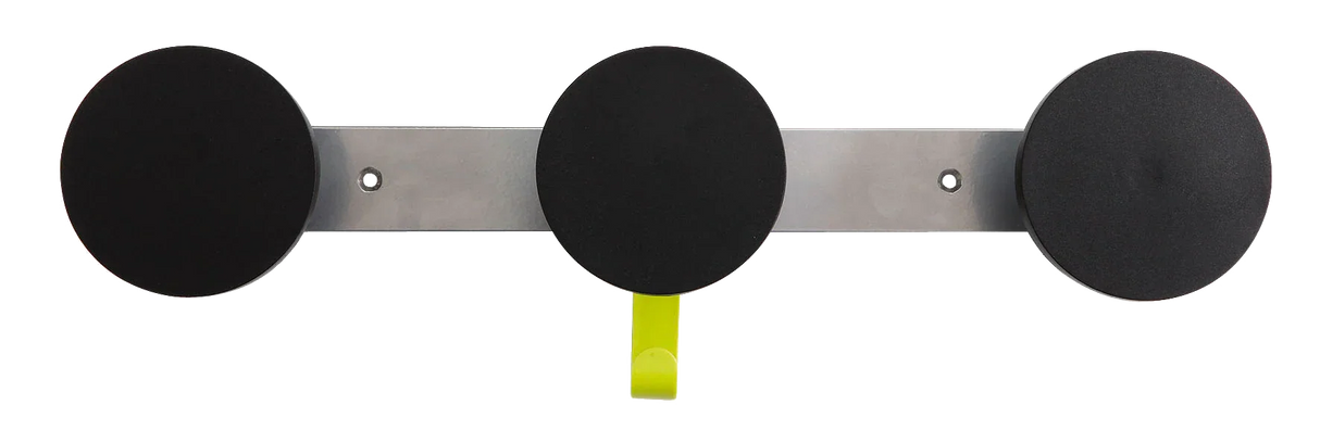 Wall-mounted organizer with three round black pads and one yellow hook for workspace storage