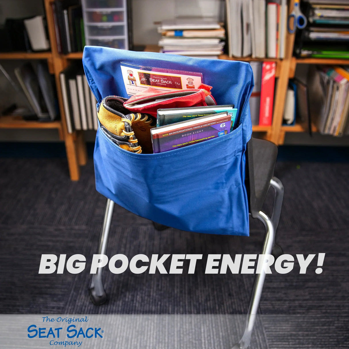 Blue Seat Sack storage pocket on chair back filled with school supplies and books in classroom