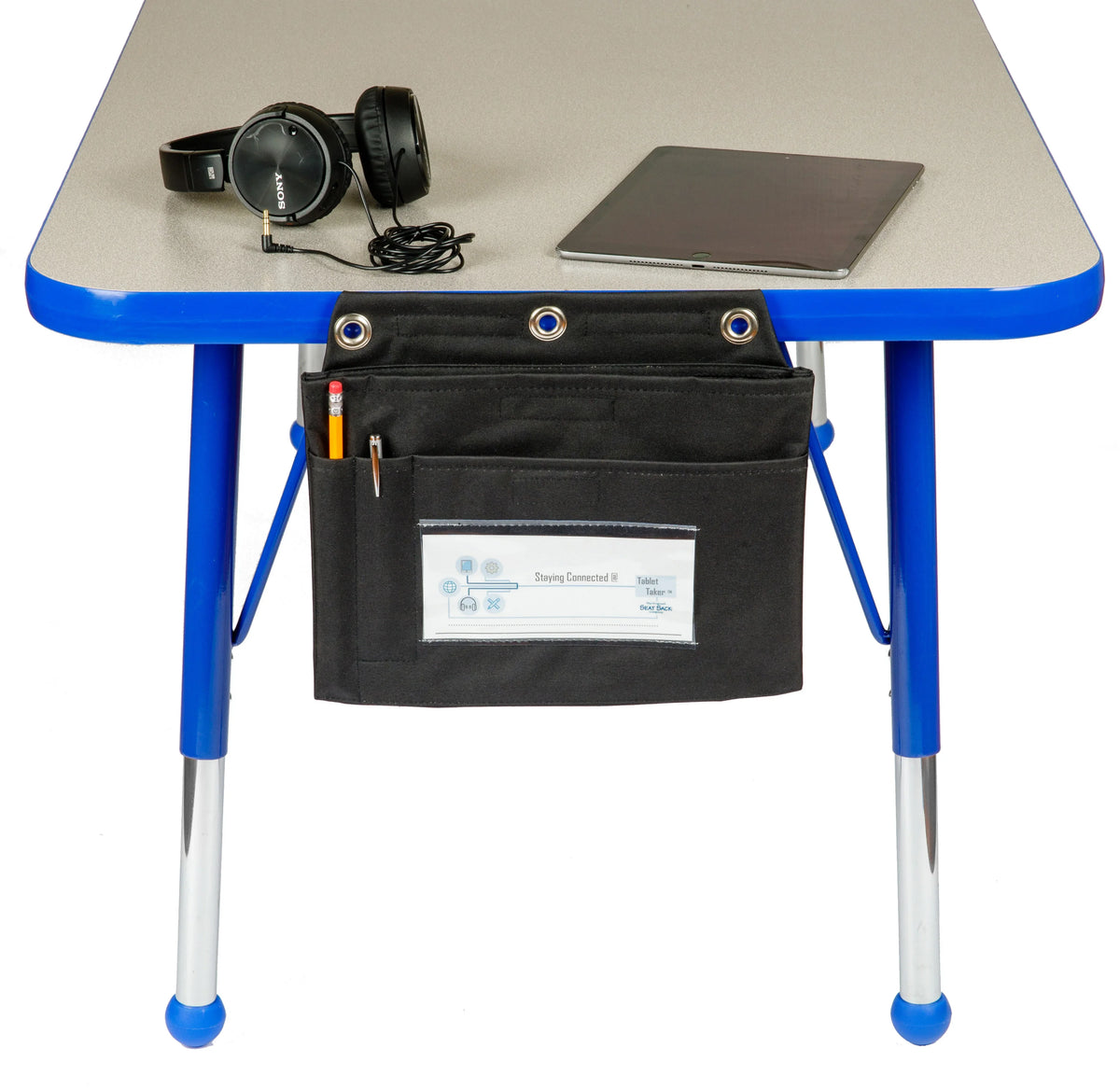 Seat Sack Tablet Taker hanging storage pouch on a classroom desk with a tablet and headphones