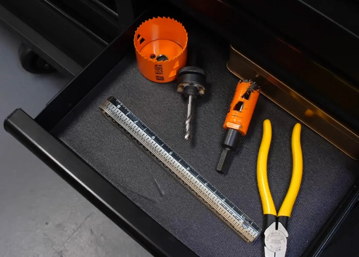 Victor® Zip Stick 18 inch magnetic ruler in a tool drawer with pliers and hole saws.