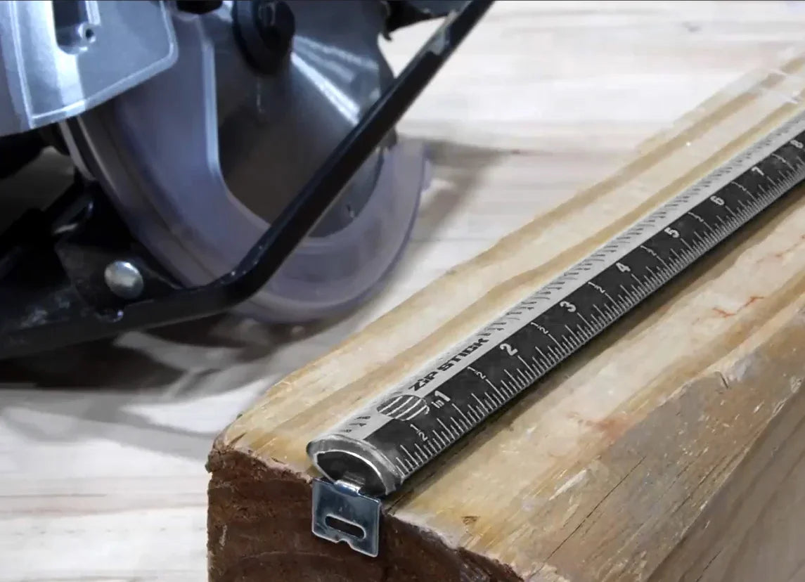 Victor Zip Stick 18 inch magnetic ruler placed on a wooden beam next to a circular saw.