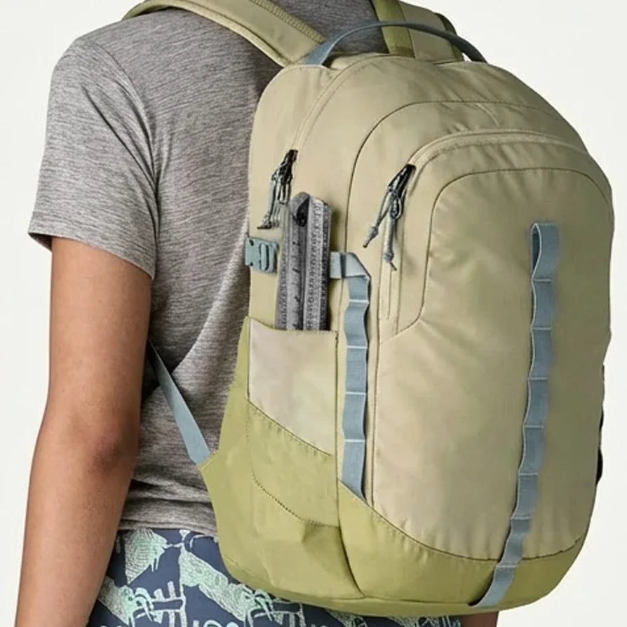 Victor Zip Stick magnetic measuring tool stored in the side pocket of a khaki backpack.