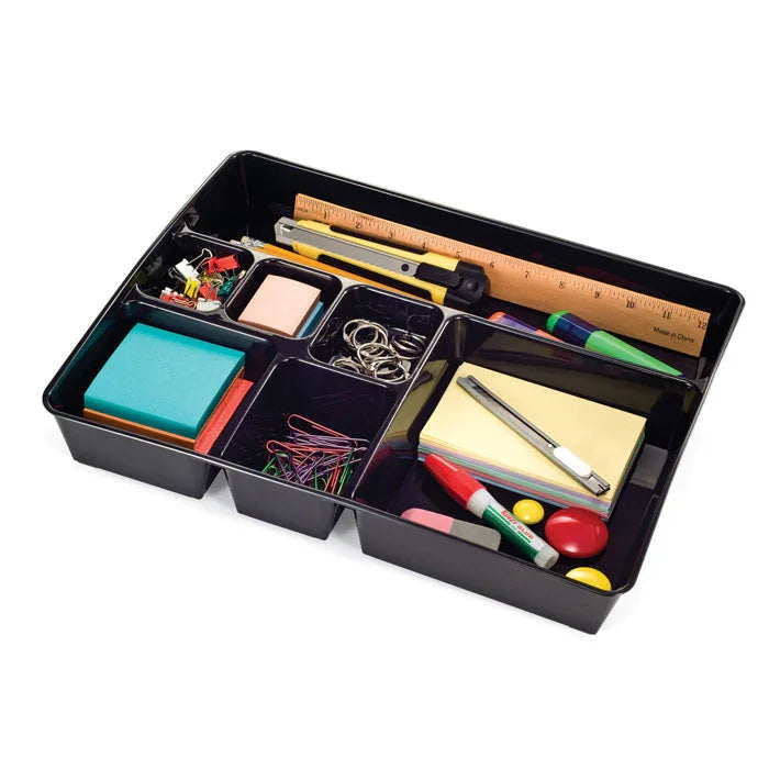 Black desk drawer organizer tray with office supplies like sticky notes, ruler, pens, and clips