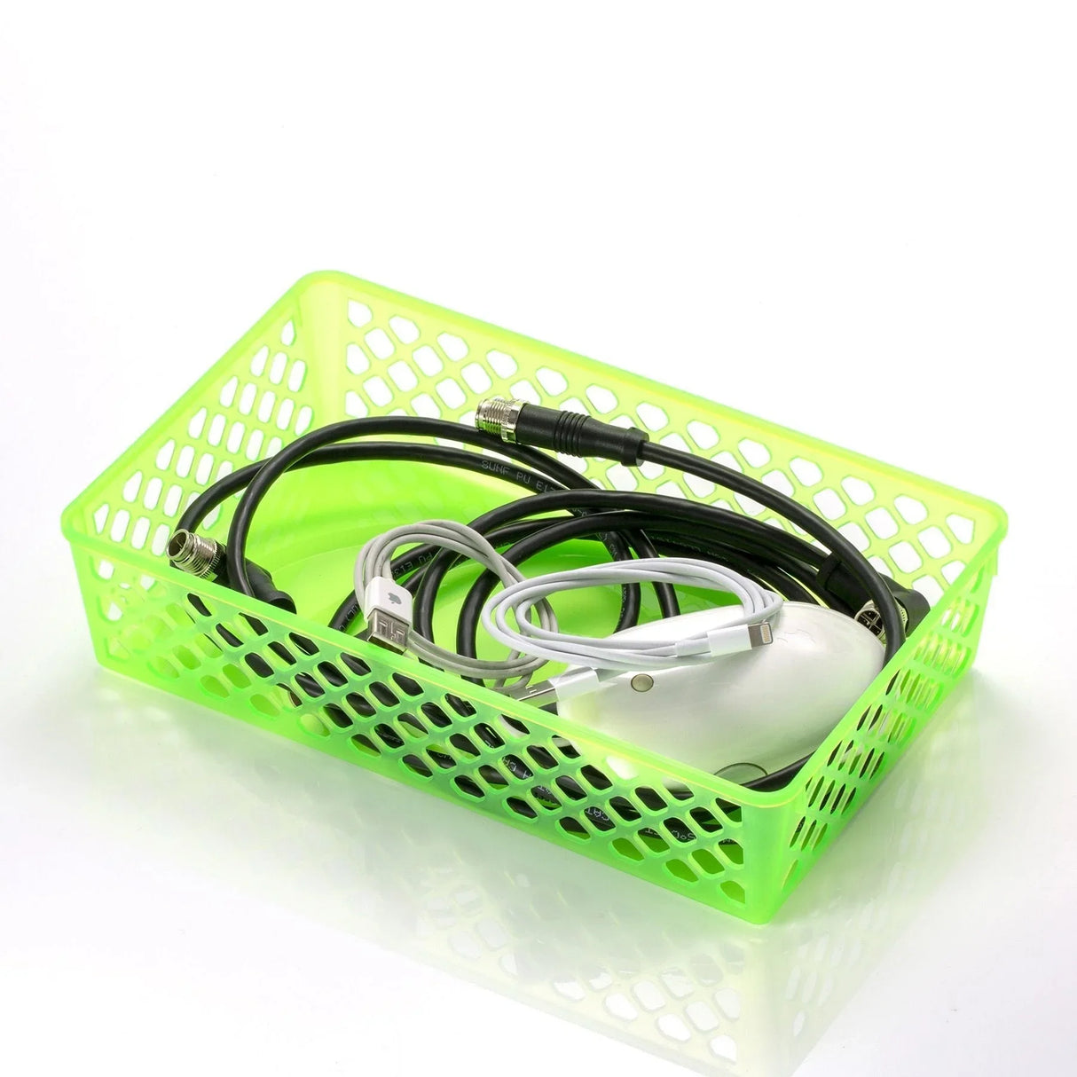 Green plastic supply basket with cables and a computer mouse on white background