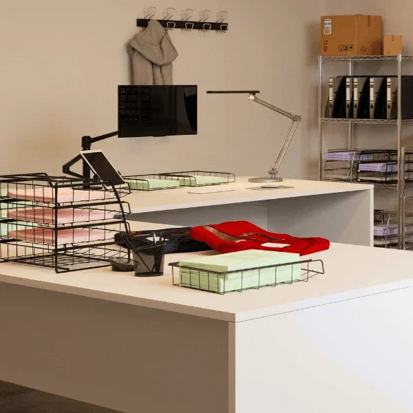 Alba 4 drawer metal letter tray organizer on a white office desk with workspace accessories