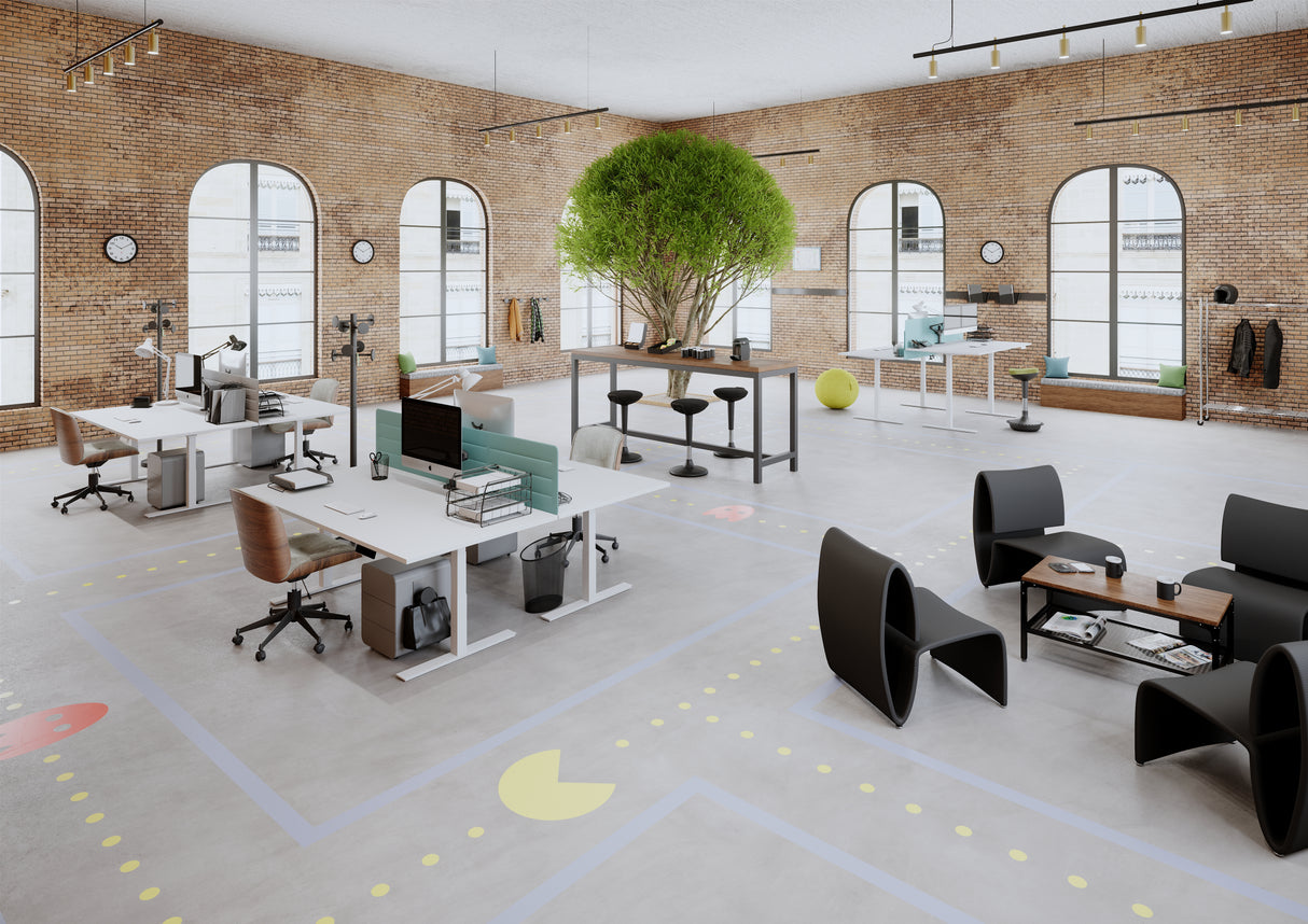 Contemporary office space with mesh black reception chairs, collaborative desks, and natural lighting.