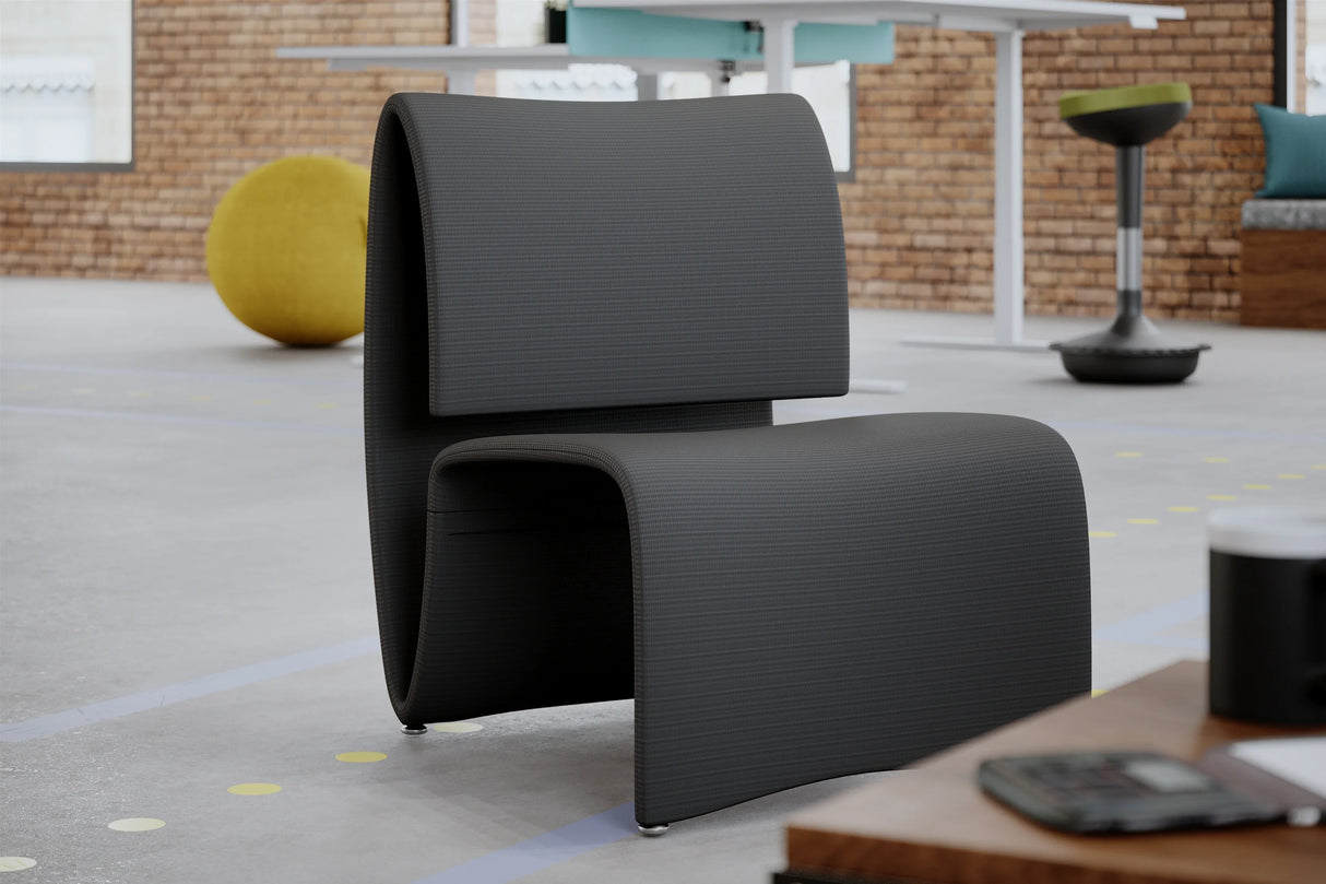Modern black mesh reception chair with curved design in open office space