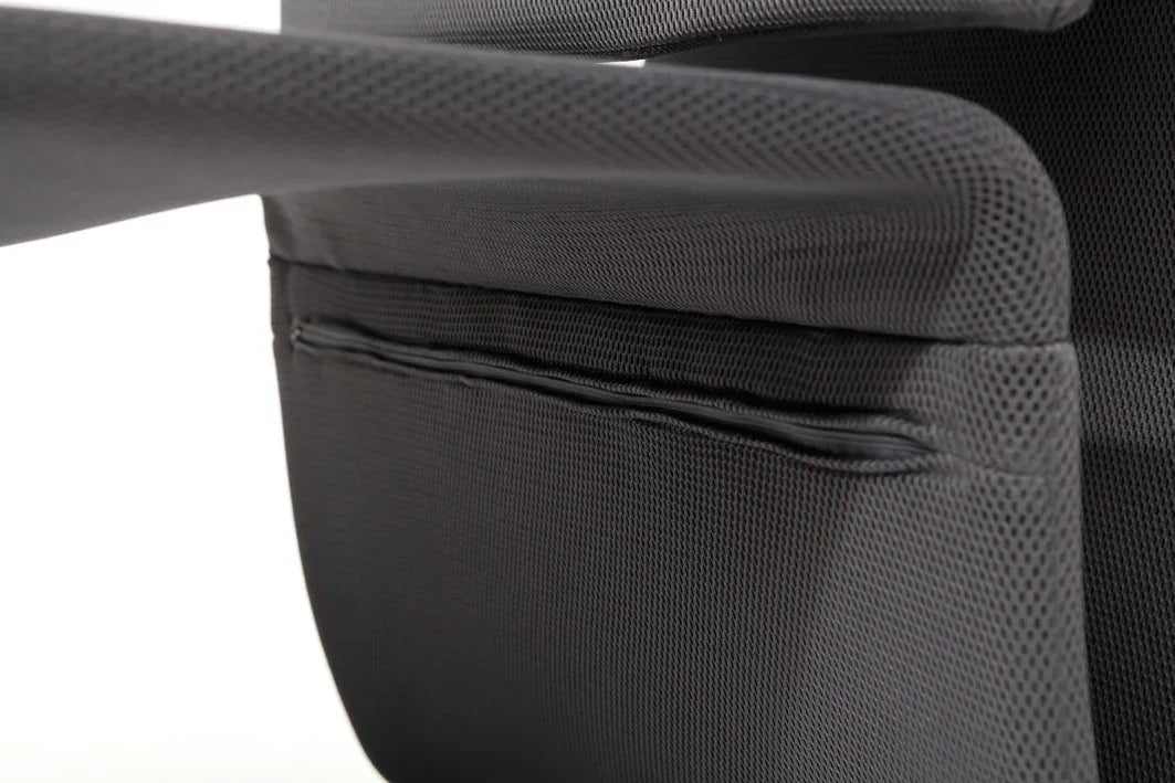 Close-up of black mesh office reception chair with padded armrest and modern design