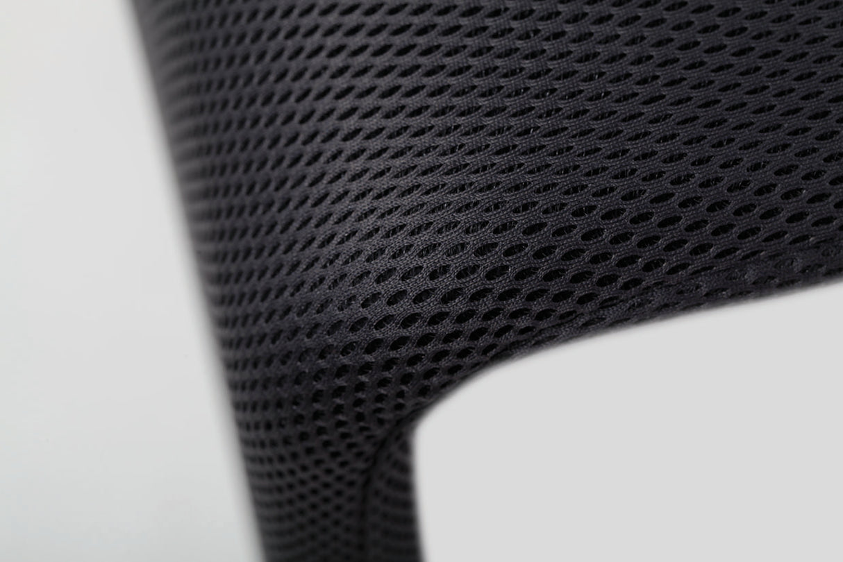 Close-up of black mesh fabric on office reception chair backrest