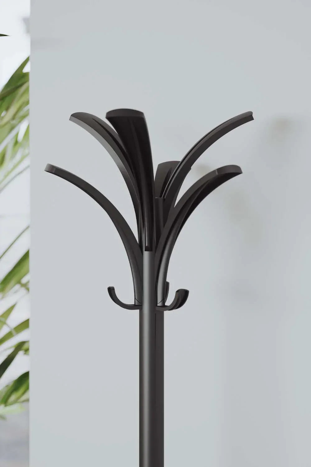 Modern black coat rack with palm leaf design, ideal for home or office organization