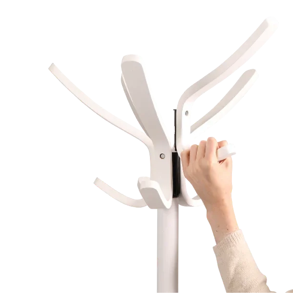 Hand assembling modern white wood coat stand with multiple hooks