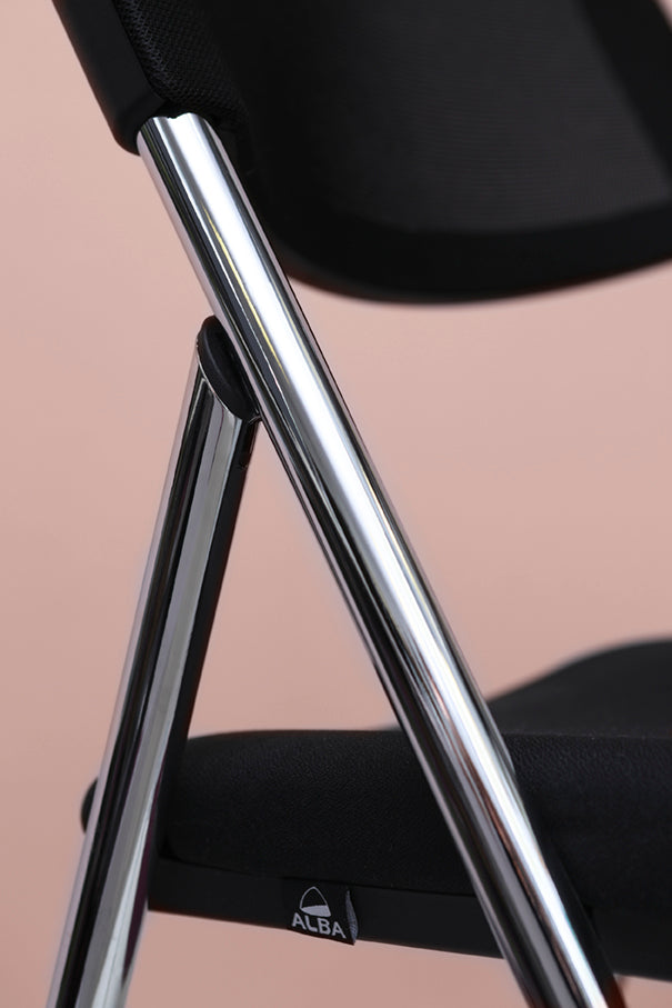 Close-up of black mesh folding chair with chrome frame on pastel background