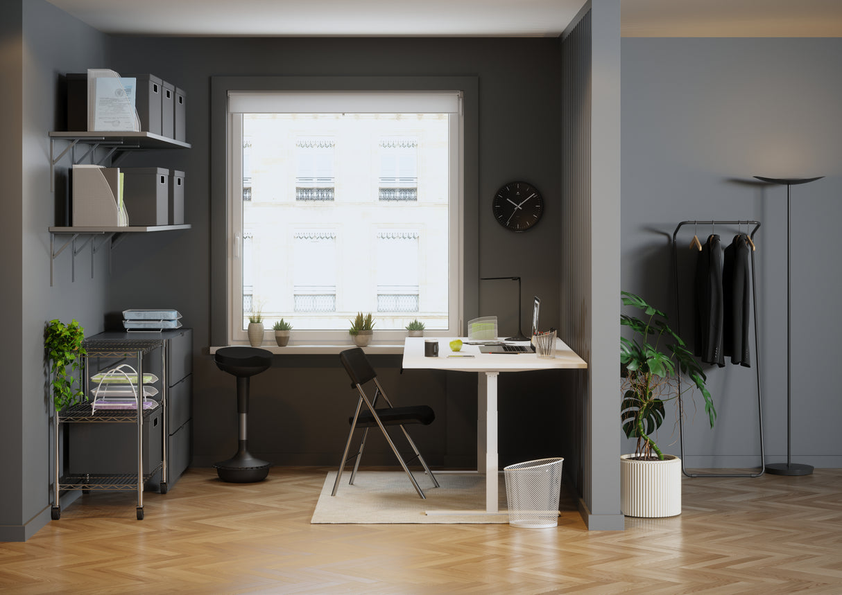 Black mesh folding chair with chrome frame at modern home office desk